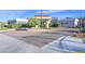 Attractive clubhouse exterior, featuring modern design elements and a neatly paved entrance area at 10150 Emerald Sunset Ct, Las Vegas, NV 89148