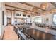 Spacious common area with abundant seating, modern lighting, and multiple TVs at 10150 Emerald Sunset Ct, Las Vegas, NV 89148