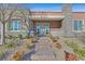 Inviting front entrance with stone pathway, desert landscaping, and decorative stone accents at 10150 Emerald Sunset Ct, Las Vegas, NV 89148