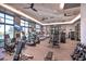 Bright gym features modern equipment, ceiling fans, and large windows at 10150 Emerald Sunset Ct, Las Vegas, NV 89148