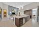 Open kitchen and living area with granite counters, stainless appliances, and modern decor at 10150 Emerald Sunset Ct, Las Vegas, NV 89148