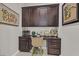 Cozy office nook featuring custom cabinetry, neutral colors, and stylish décor at 10150 Emerald Sunset Ct, Las Vegas, NV 89148