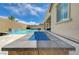 Inviting backyard with pool, spa, and blue-glass fire pit at 10172 Fire Skye Ave, Las Vegas, NV 89166