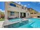 Spacious backyard with sparkling pool, raised spa, and covered patio at 10172 Fire Skye Ave, Las Vegas, NV 89166