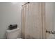 Clean bathroom with a shower/tub, a toilet, and gray storage box at 10172 Fire Skye Ave, Las Vegas, NV 89166