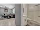 Charming bathroom features a stand-up shower with white subway tiles, a white vanity, and gray walls at 10172 Fire Skye Ave, Las Vegas, NV 89166