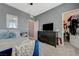 Well-decorated bedroom with gray walls, a bed, and a view into the walk-in closet at 10172 Fire Skye Ave, Las Vegas, NV 89166