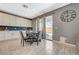 Cozy dining area adjacent to the kitchen features sliding door access to the outdoor pool at 10172 Fire Skye Ave, Las Vegas, NV 89166