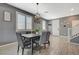 Inviting dining room features a modern chandelier and plenty of natural light at 10172 Fire Skye Ave, Las Vegas, NV 89166