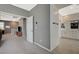 Hallway featuring wood-look tile flooring, neutral colors, and view to the living room at 10172 Fire Skye Ave, Las Vegas, NV 89166