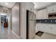 Stylish kitchen with stainless steel refrigerator, white cabinets, and attractive backsplash at 10172 Fire Skye Ave, Las Vegas, NV 89166
