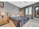 Calm main bedroom with a wooden bed frame, neutral colors, and cozy ambiance at 10172 Fire Skye Ave, Las Vegas, NV 89166