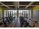 Bright, airy fitness center with stationary bikes and rowing machines, offering a complete workout experience at 10326 Scalata Ave, Las Vegas, NV 89166
