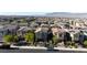An aerial view of the home in a neighborhood of similar homes and desert mountains in the distance at 10468 Skye Knoll Ave, Las Vegas, NV 89166