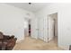 View of a bedroom that has doors leading to a bedroom and a bathroom at 10468 Skye Knoll Ave, Las Vegas, NV 89166