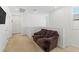 Comfortable loft area with carpeting and a cozy loveseat, perfect for relaxation at 10468 Skye Knoll Ave, Las Vegas, NV 89166