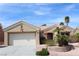 Charming single-story home with a well-manicured front yard and a two-car garage at 10732 Cedar Creek Ave, Las Vegas, NV 89134
