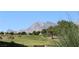 Golf course with a backdrop of majestic mountains, offering scenic views and recreational enjoyment for residents at 10732 Cedar Creek Ave, Las Vegas, NV 89134