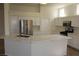 Modern kitchen island with marble countertops and stainless steel appliances at 10732 Cedar Creek Ave, Las Vegas, NV 89134