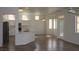 Bright kitchen with white cabinets, stainless steel appliances, and a breakfast bar at 10732 Cedar Creek Ave, Las Vegas, NV 89134