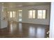 Spacious living room featuring tiled floors, ceiling fans, and multiple windows at 10732 Cedar Creek Ave, Las Vegas, NV 89134