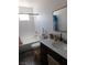 Well-lit bathroom with a shower-tub combo, white subway tile, and modern fixtures at 1075 Greymouth St, Las Vegas, NV 89110