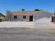 Single-story home featuring a low-maintenance rock garden and an attached two-car garage at 1075 Greymouth St, Las Vegas, NV 89110