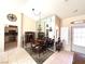 Elegant dining room with chandelier and a large mirror to enhance the space at 11025 Hawk Valley Ave, Las Vegas, NV 89134