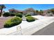 Charming one-story home with a well-manicured front yard and an inviting driveway at 11025 Hawk Valley Ave, Las Vegas, NV 89134
