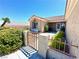 Welcoming front gate and courtyard with stucco walls create an intimate entrance to the property at 11025 Hawk Valley Ave, Las Vegas, NV 89134