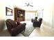 Comfortable living room with plush seating, built-in shelving, and lots of natural light at 11025 Hawk Valley Ave, Las Vegas, NV 89134