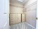 Bright walk-in closet featuring built-in shelving and drawers for optimal organization at 11025 Hawk Valley Ave, Las Vegas, NV 89134