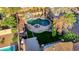 Aerial view showcasing a private backyard oasis with a pool, waterfall feature, and outdoor seating area at 112 Kava Kava St, Henderson, NV 89015
