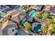 Aerial view of an expansive backyard with a pool, lush greenery, and ample space for outdoor activities at 112 Kava Kava St, Henderson, NV 89015