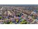 An aerial shot showing the neighborhood with lush green trees and neat home exteriors at 112 Kava Kava St, Henderson, NV 89015
