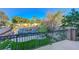 A picturesque view of the backyard, highlighting the lush landscaping and elegant wrought iron details at 112 Kava Kava St, Henderson, NV 89015