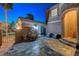 Charming courtyard with a tiled patio, a decorative fountain, and cozy seating, perfect for relaxation at 112 Kava Kava St, Henderson, NV 89015