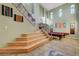 Grand entryway with a staircase, high ceilings, neutral walls and stylish decor creates an inviting ambiance at 112 Kava Kava St, Henderson, NV 89015