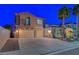 A modern two-story home with a three-car garage and well-manicured landscaping, captured during twilight at 112 Kava Kava St, Henderson, NV 89015