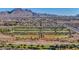 Picturesque neighborhood with baseball fields, green spaces, and mountain views, creating a vibrant community setting at 112 Kava Kava St, Henderson, NV 89015