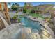 Stunning pool with a rock slide, perfect for outdoor entertaining and relaxation at 112 Kava Kava St, Henderson, NV 89015