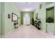 Bright foyer with tile flooring, high ceilings, decorative lighting, and neutral wall color at 11253 Sanbury Brook St, Las Vegas, NV 89183