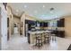 Gourmet kitchen features granite countertops, stainless steel appliances, and a large central island with seating at 11253 Sanbury Brook St, Las Vegas, NV 89183