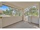 Balcony with a concrete floor, partial walls, and a view of trees and rooftops at 1313 Pinto Rock Ln # 202, Las Vegas, NV 89128
