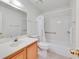 Bathroom featuring a single sink vanity, toilet, and a shower-tub combination with grab bars at 1313 Pinto Rock Ln # 202, Las Vegas, NV 89128