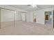 Spacious bedroom featuring mirrored closet doors, a ceiling fan, and access to an ensuite bathroom at 1313 Pinto Rock Ln # 202, Las Vegas, NV 89128