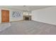 Spacious living room with a stone fireplace and large windows for natural light at 1313 Pinto Rock Ln # 202, Las Vegas, NV 89128