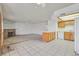 Open layout with a kitchen, living room, and tile flooring at 1313 Pinto Rock Ln # 202, Las Vegas, NV 89128