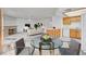 Virtually staged living area with adjacent kitchen and dining space at 1313 Pinto Rock Ln # 202, Las Vegas, NV 89128
