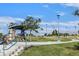 Kellogg Zaher Park with picnic tables, walking path, and trees at 1313 Pinto Rock Ln # 202, Las Vegas, NV 89128